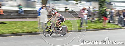 An athlete cycles in the Cologne