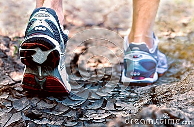 Athlete running sport shoes on trail healthy lifestyle