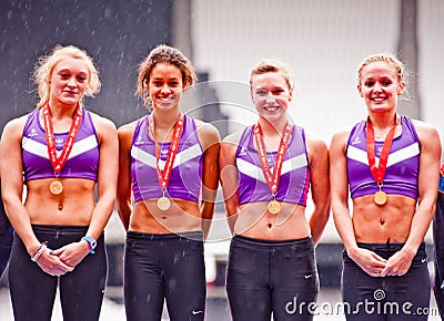 Athletes with gold medal at London Olympic stadium