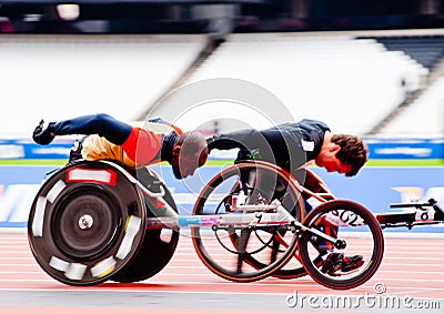 Athletes on wheelchairs racing