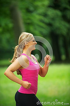 Athletic young woman jogging in the park