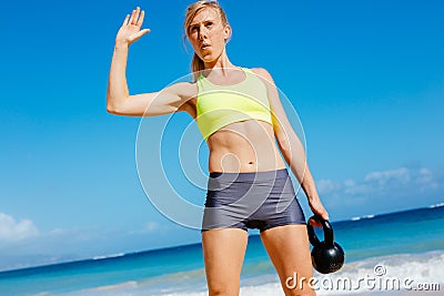 Attractive Athletic Woman Doing Kettle Bell Workout