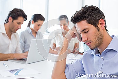 Attractive businessman resting at work