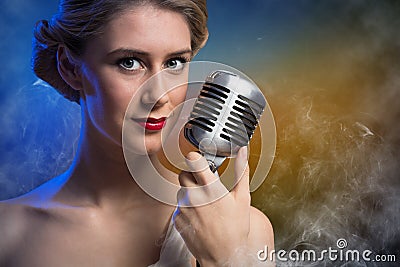 Attractive female singer with microphone