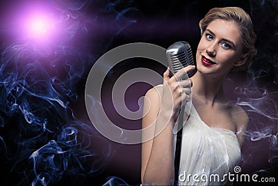 Attractive female singer with microphone