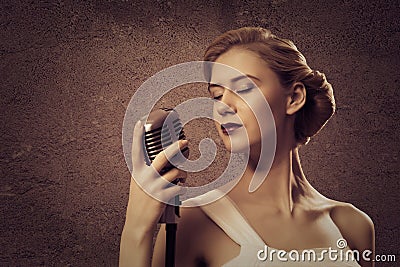 Attractive female singer with microphone