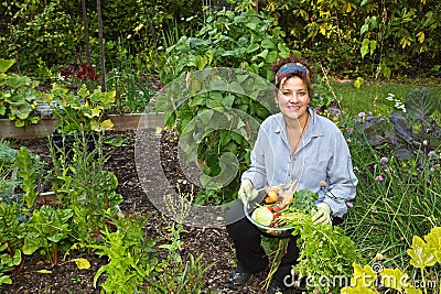 Attractive Home Gardener with vegetables