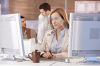 Attractive woman at computer training course