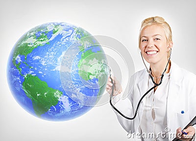 Attractive woman doctor examining planet Earth