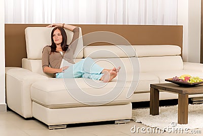 Attractive woman relax living room leather sofa