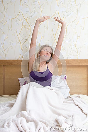 Attractive woman stretching in the morning