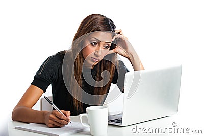 Attractive young asian indian teenage woman studying with laptop