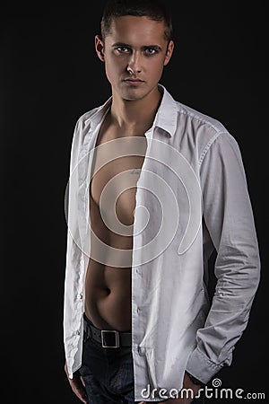 Sexy young man in white shirt