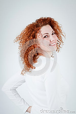 Attractive young redhead woman smiling portrait