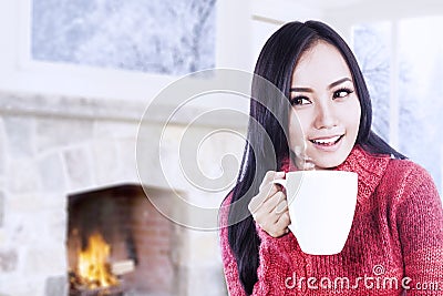 Attractive young woman enjoy coffee at home