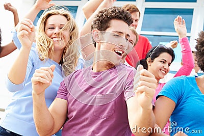 Audience Dancing At Outdoor Concert Performance