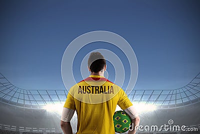 Australia football player holding ball