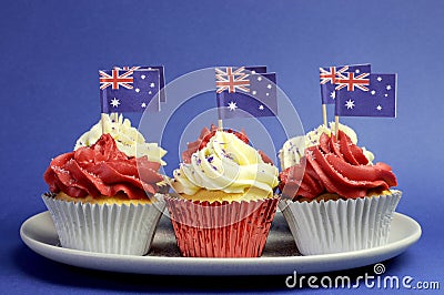 Australian theme red, white and blue cupcakes with national flag.