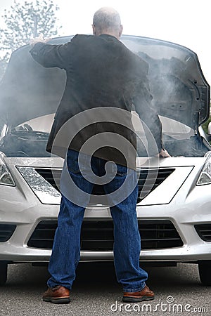 Auto Driver and Open Car Engine Hood in Fire Smoke
