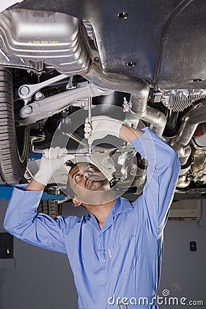 Auto mechanic under car