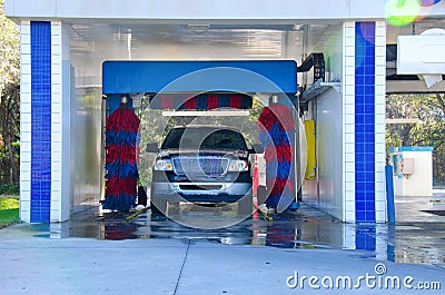 Automated car wash with a soapy truck