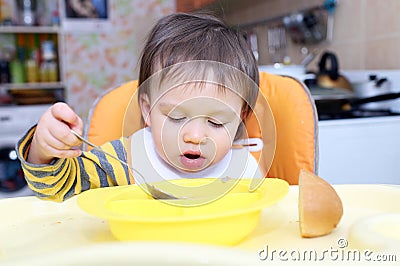 Baby age of 16 months eating soup