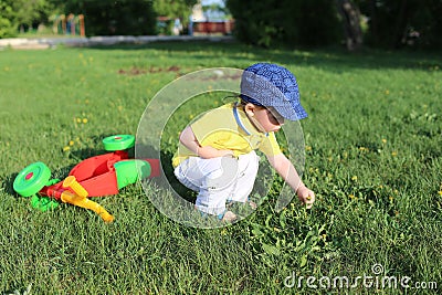 Baby age of 20 months walking in summer