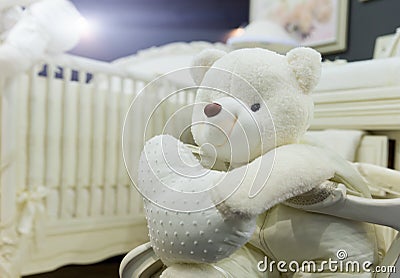 Baby bedroom with white teddy bear