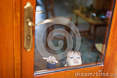 Baby behind closed door