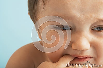 Baby Boy Crying With Finger In Mouth