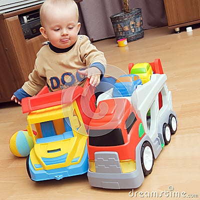 Baby boy playing with trucks