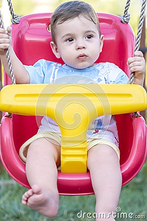 Baby boy in swing