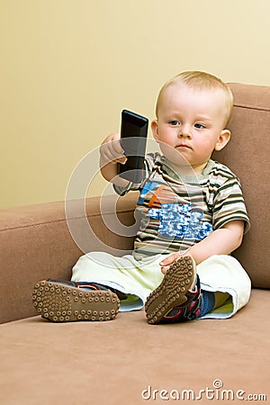 Baby boy with TV remote