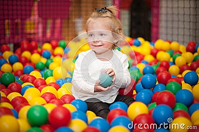 Baby girl in ball pool