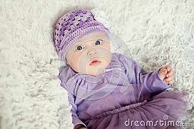 Baby girl with knitted hat with flower