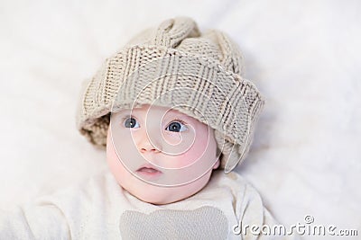 Baby in a huge knitted hat