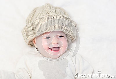 Baby in a huge knitted hat