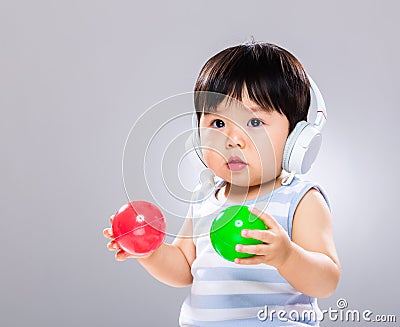 Baby listen to music and play ball