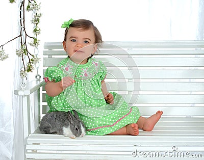 Baby and rabbit on Swing