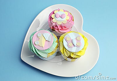 Baby shower or childrens pink, aqua & yellow cupcakes - aerial