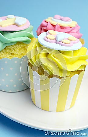 Baby shower or childrens pink, aqua & yellow cupcakes - close up yellow