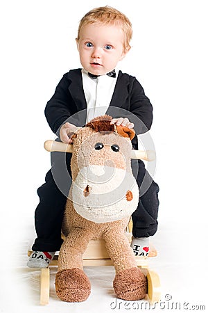 More similar stock images of ` Baby in tailcoat on rocking horse `