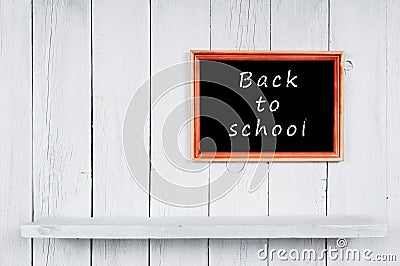 Back to school. Frame and wooden shelf.
