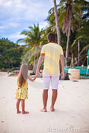 Back view of father with his adorable daughter