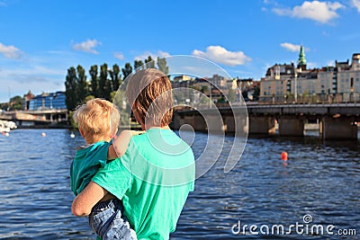 Back view of father and son looking at Stockholm
