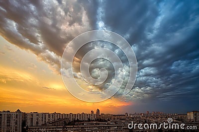 Background of a sunset storm clouds over cityscape