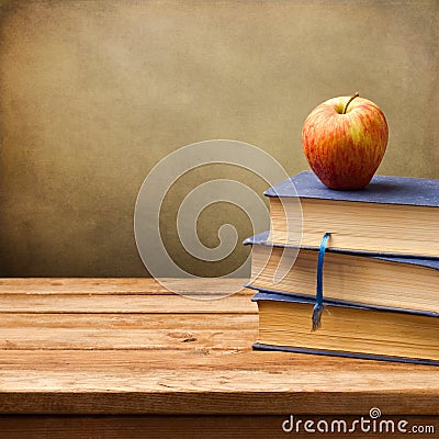 Background with vintage books and apple