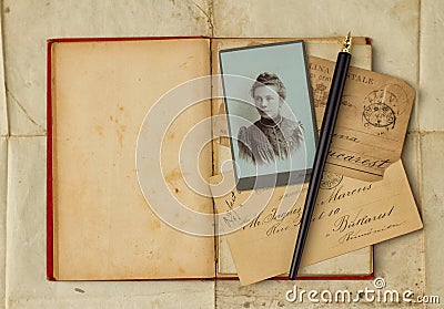 Background with vintage photo, postcards, and empty open book