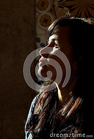 Backlight profile of a young beautiful woman