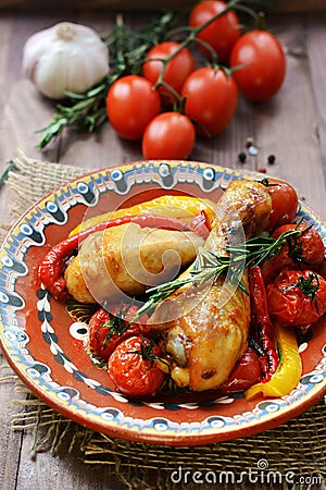 Baked chicken legs and vegetables